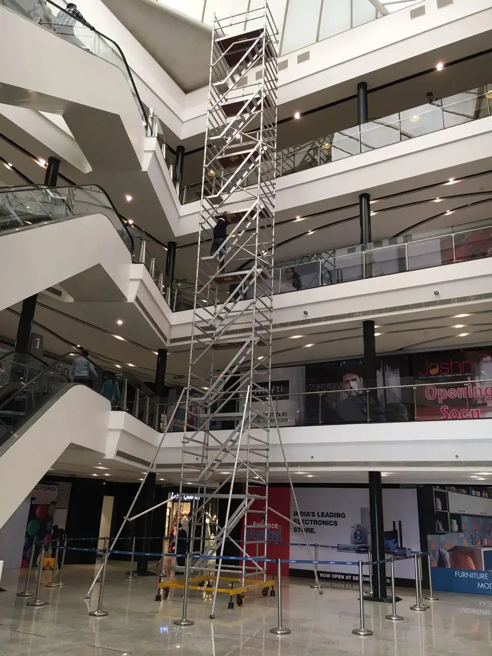 Double width aluminium scaffolding tower installed in a shopping centre