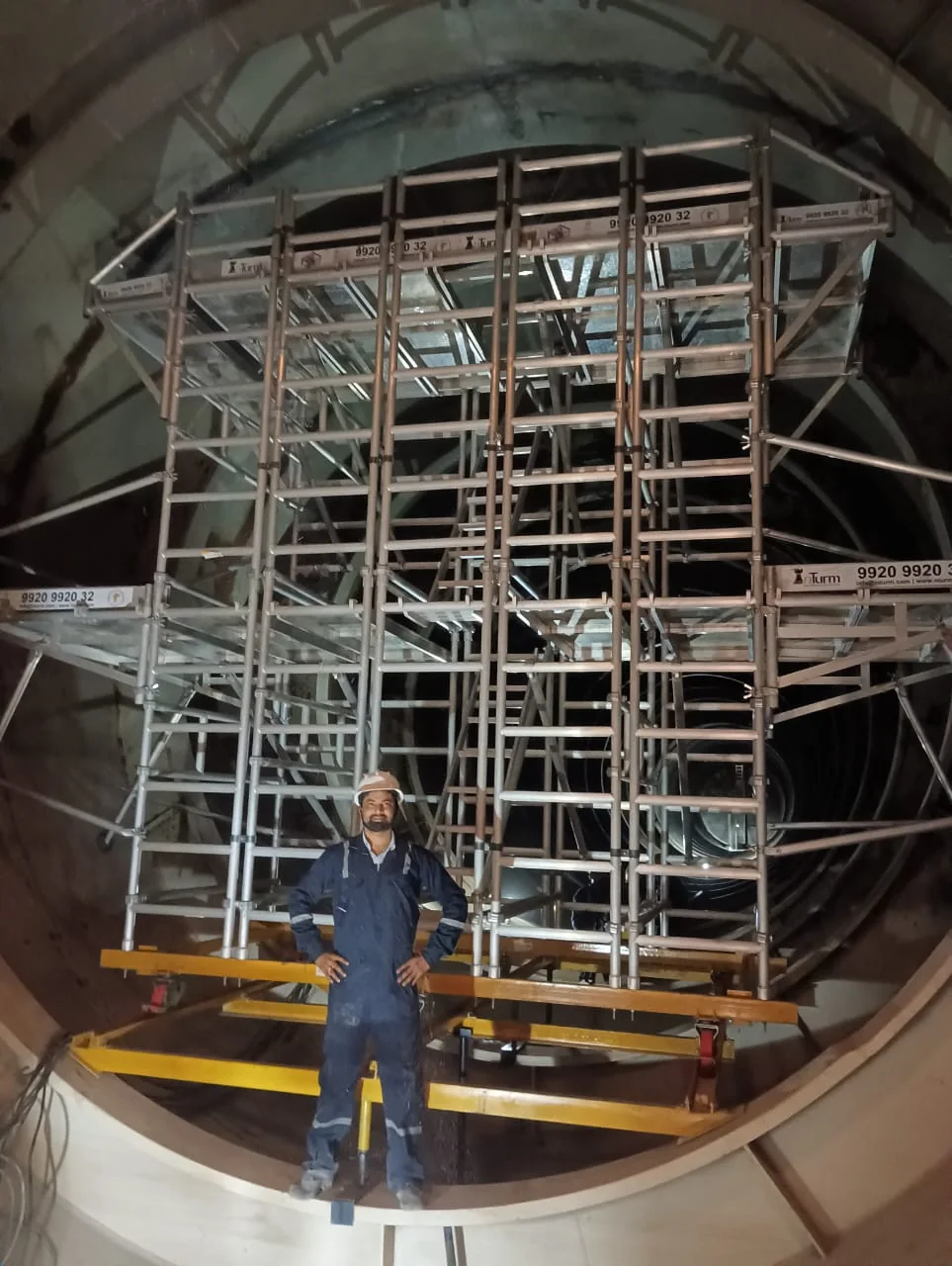 Customized aluminium access system configured inside a circular tunnel profile.